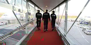 Three-French-police-at-an-airport-320x160